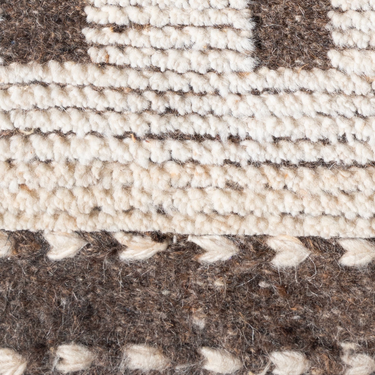 Tethered Landscapes : Monolith Rise close-up showing the wool weave and geometric motif