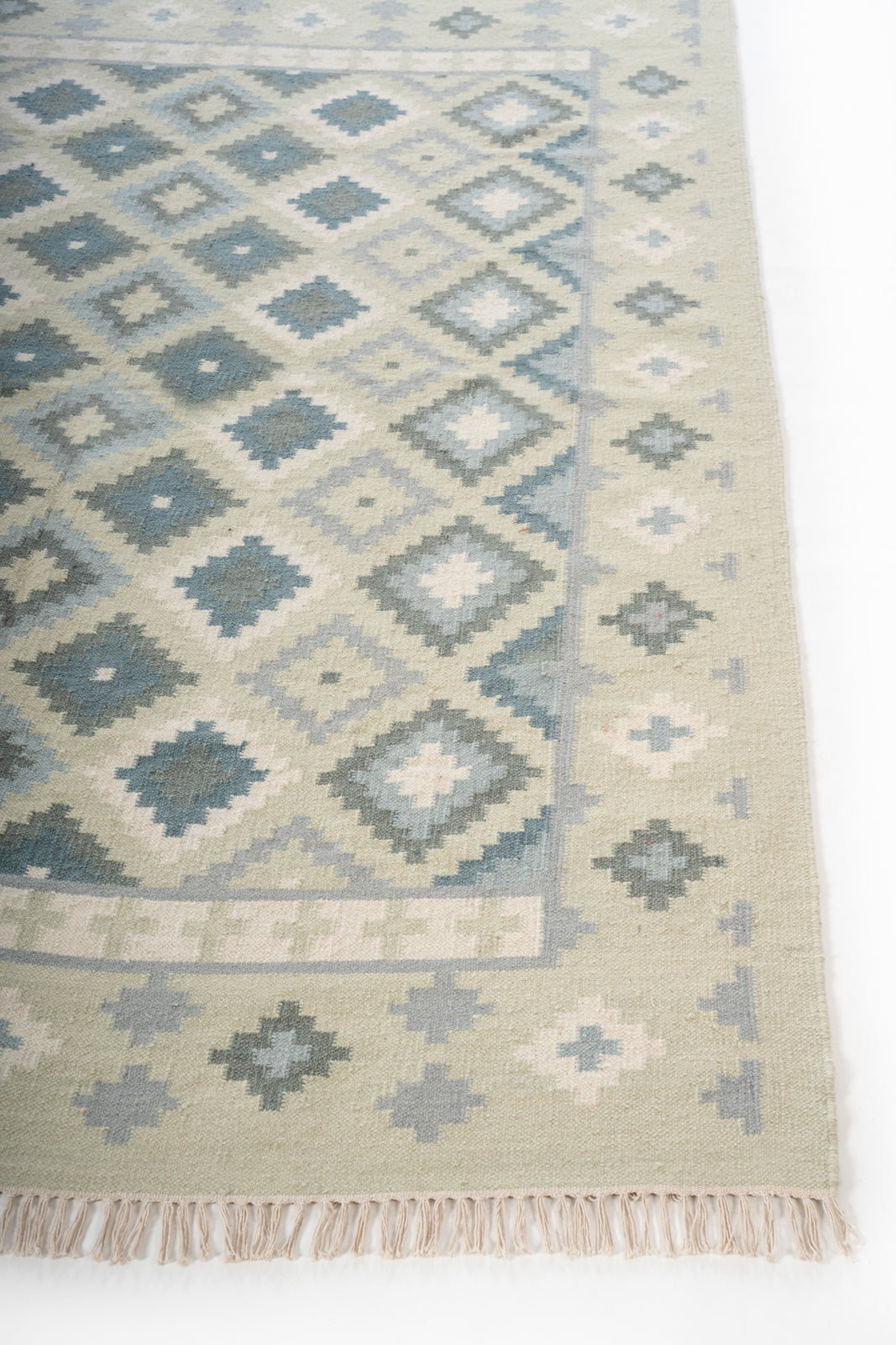 Thar Sandstone Heritage Rug wool rug styled in a living room interior