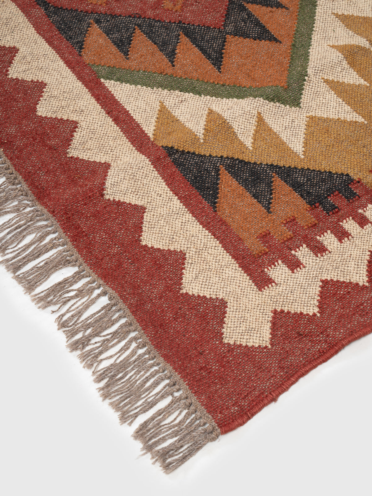 The Adobe Stack Rug close-up showing the wool weave and geometric motif