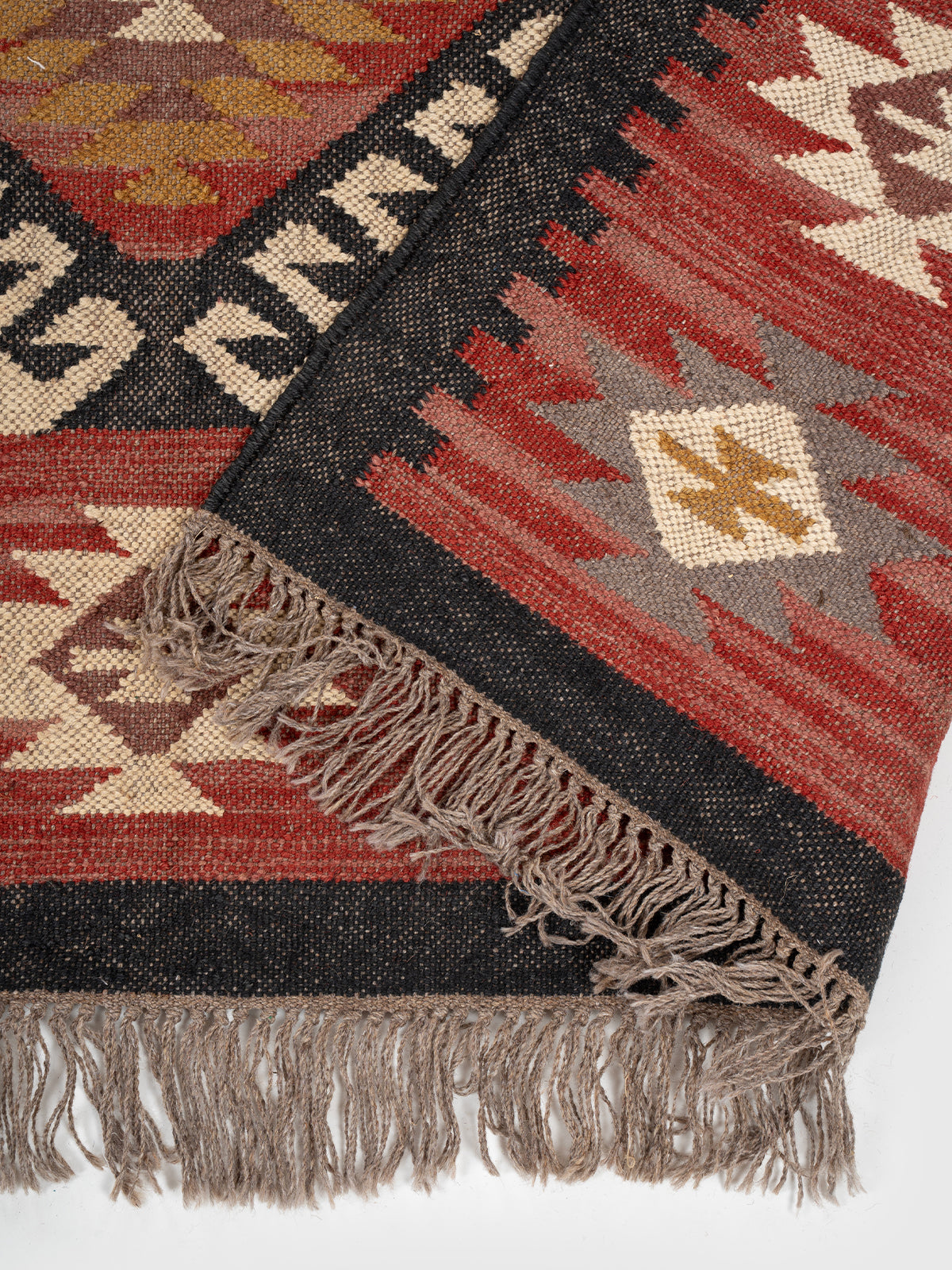 The Ancestral Column Rug detail of the traditional motif in wool