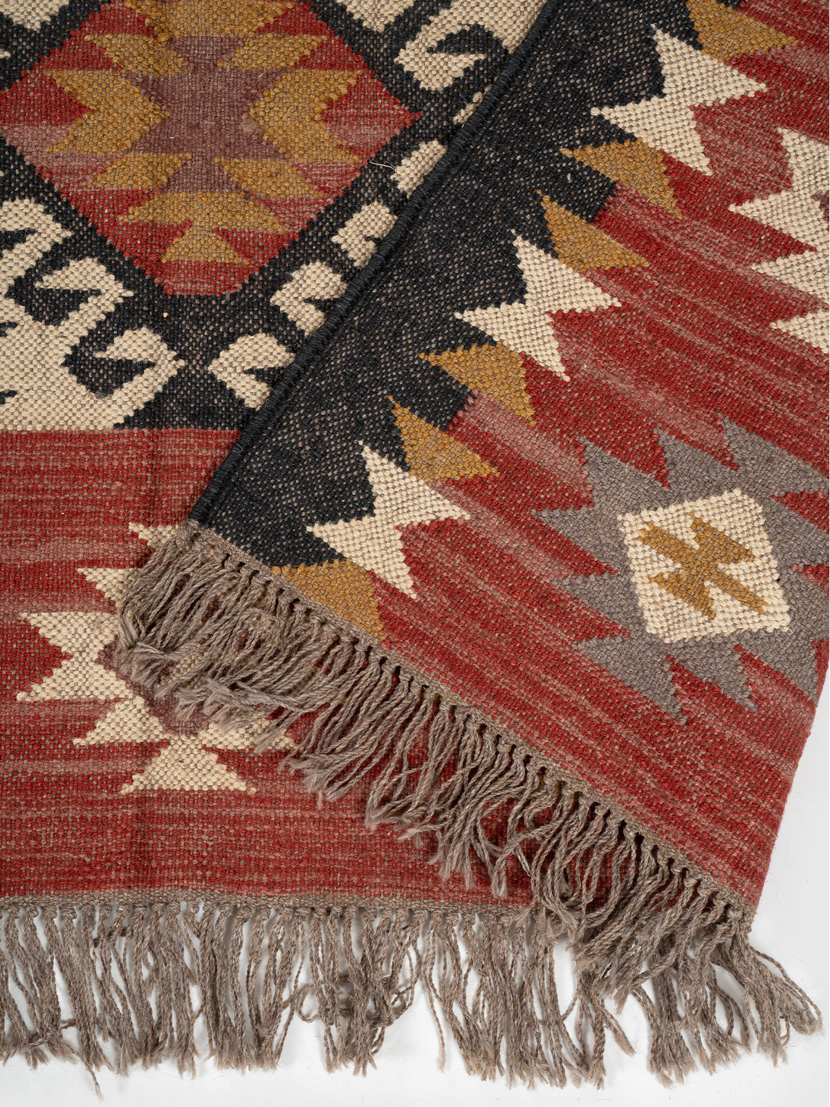 The Ancestral Glyph Rug detail of the traditional motif in wool