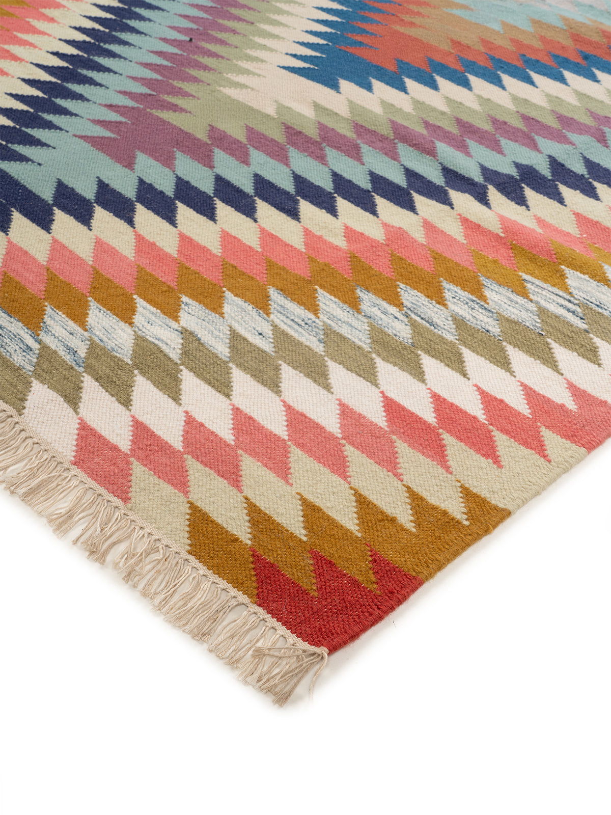 The Aurora Chevron Rug close-up showing the wool weave and geometric motif