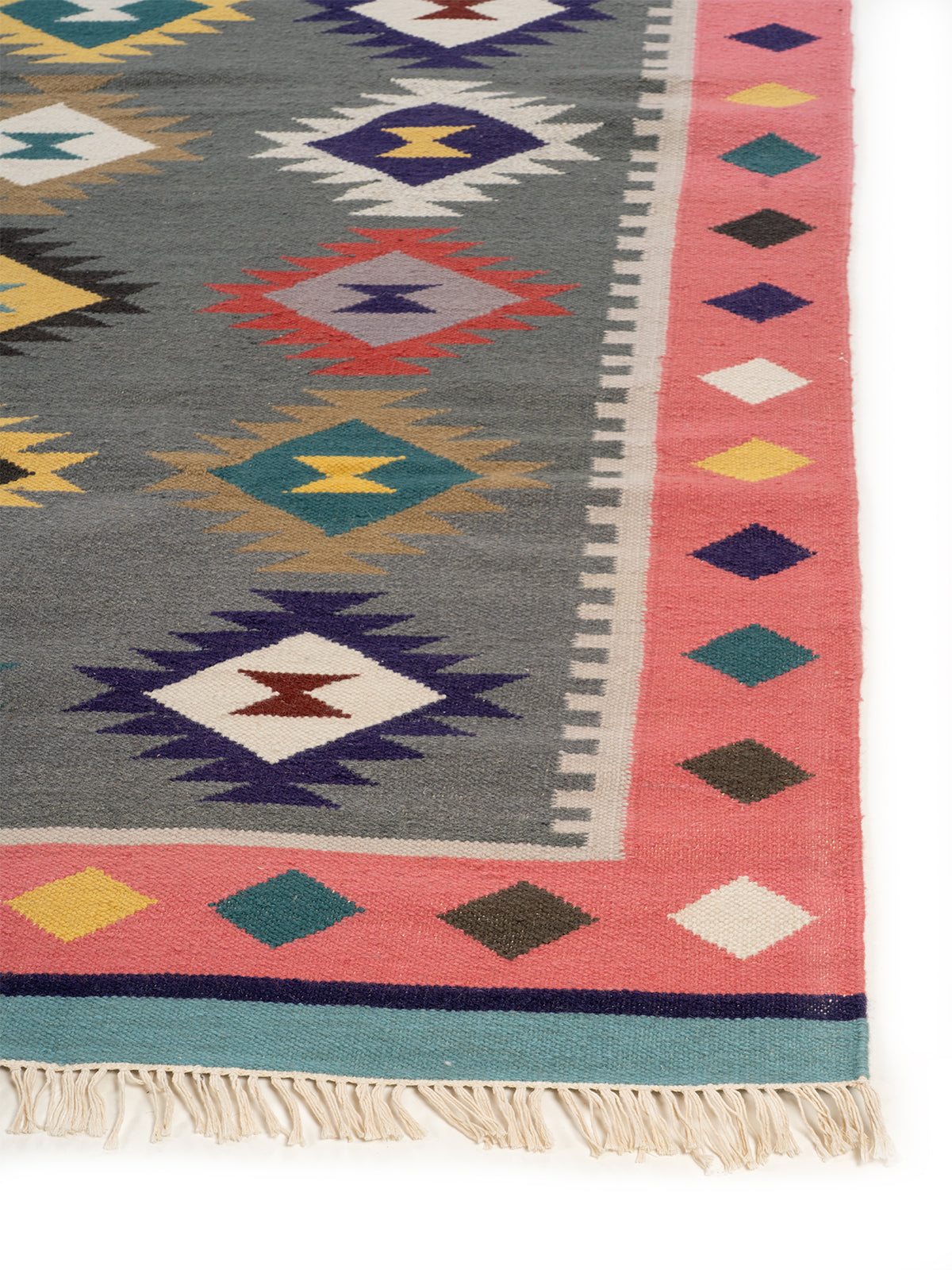 The Bohemian Delight Rug wool rug styled in a living room interior