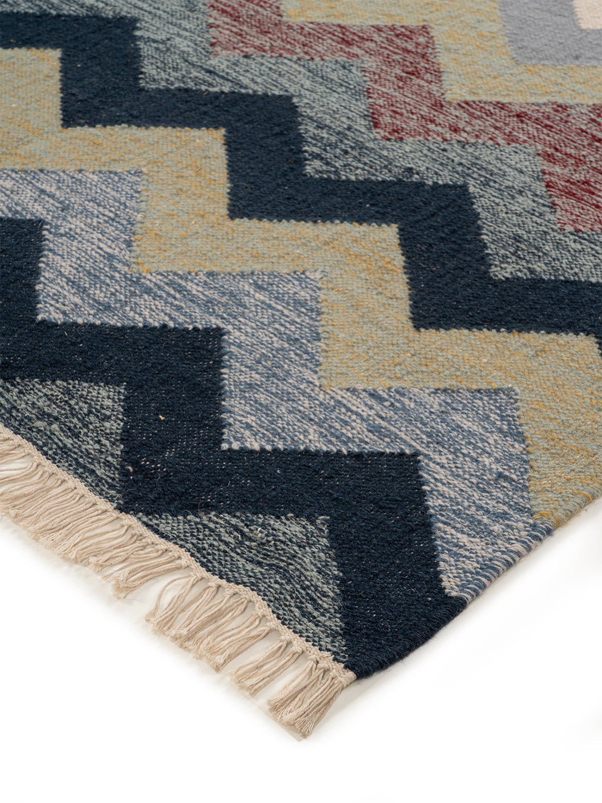The Coastal Chevron Rug close-up showing the wool weave and geometric motif