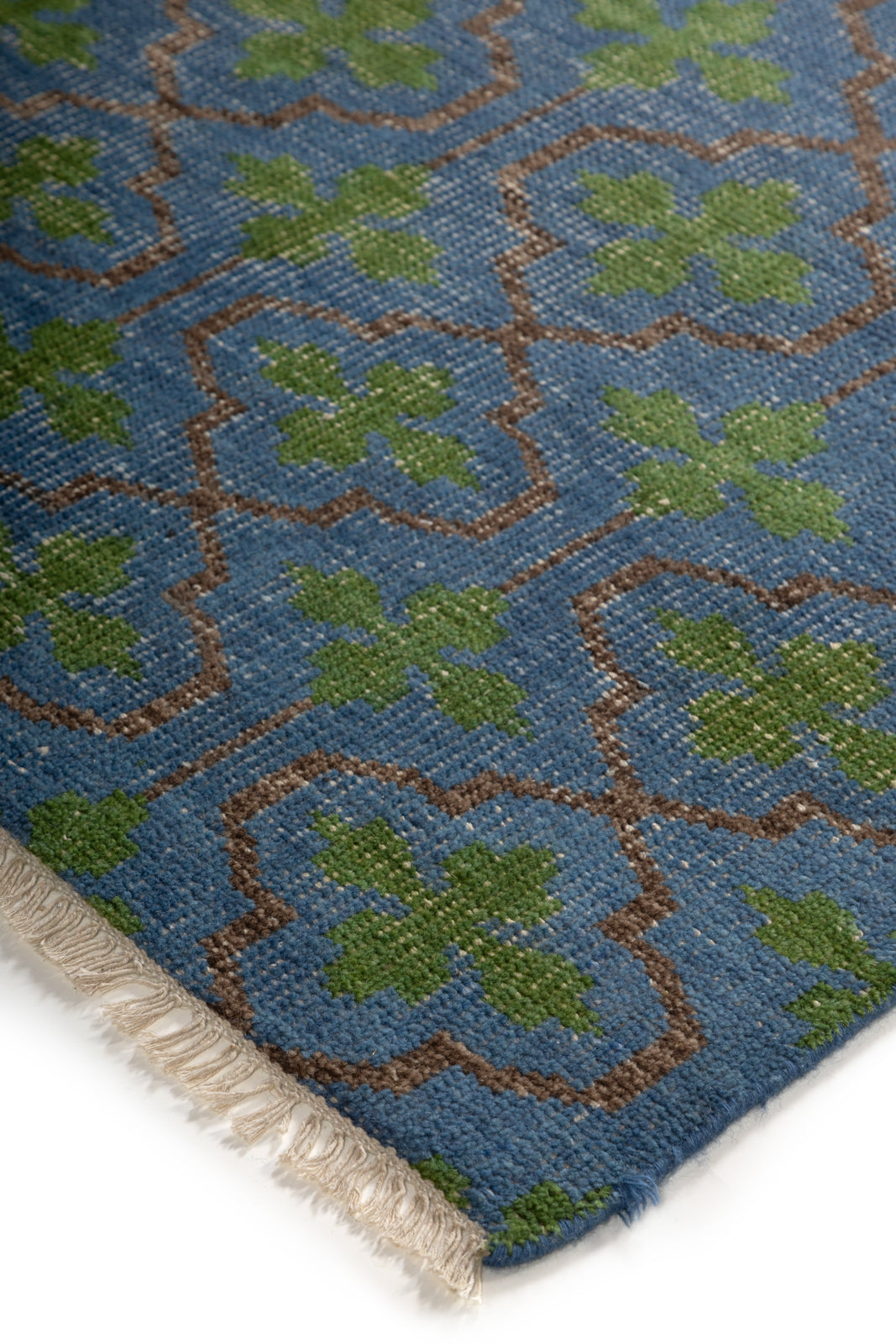 The Cotswold Meadow close-up showing the handspun wool pile and floral motif