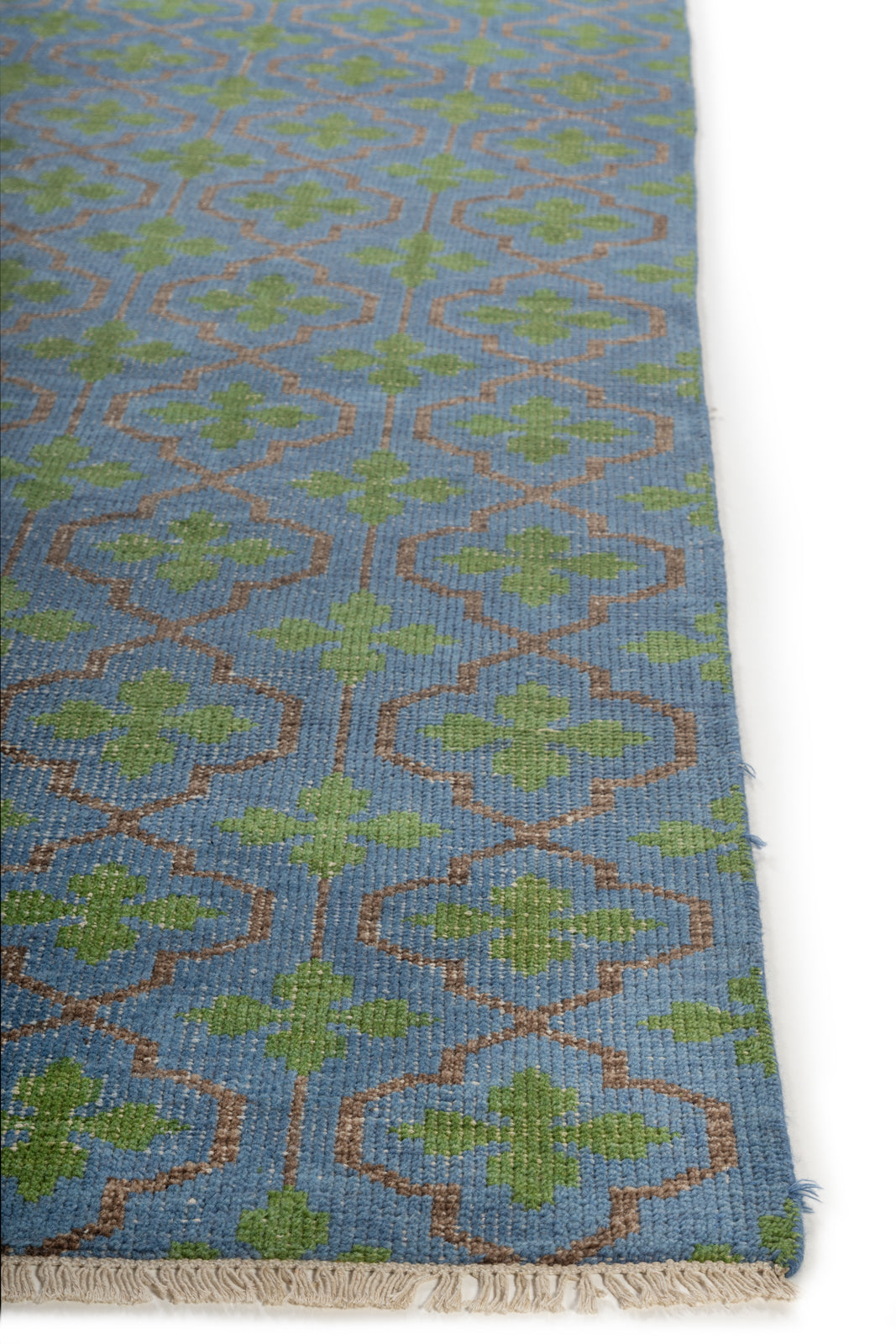 The Cotswold Meadow handspun wool rug styled in a living room interior