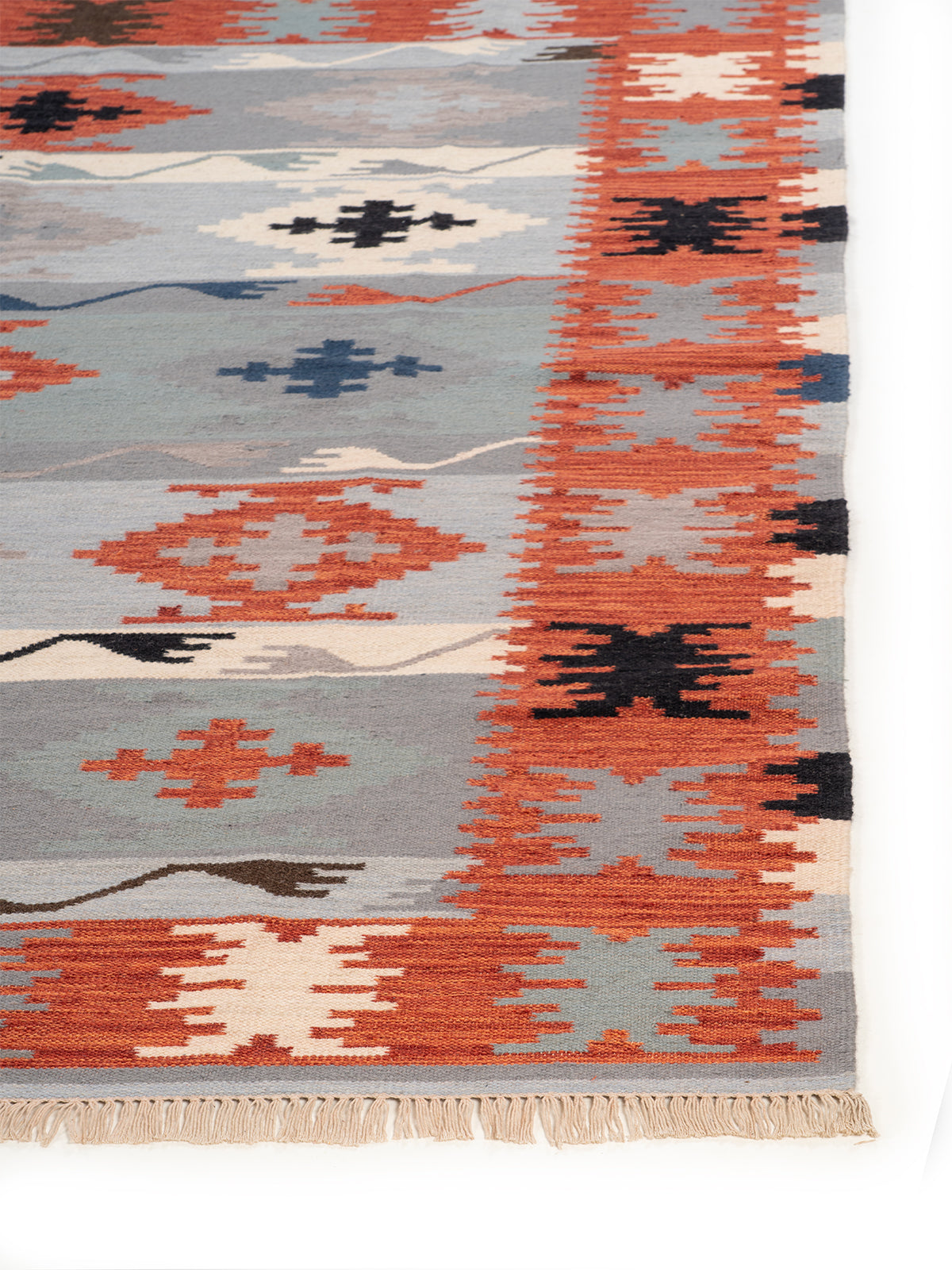 The Desert Storm Rug wool rug styled in a living room interior