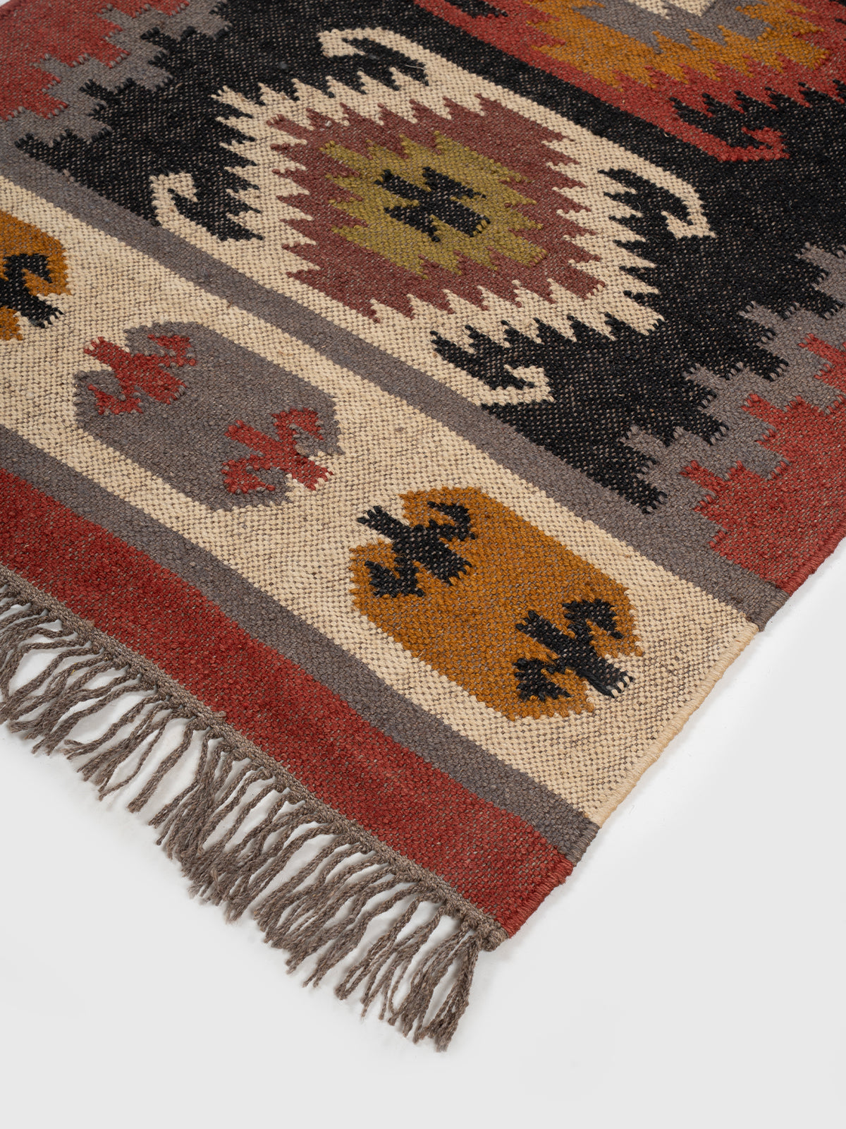 The Ember Diamond Runner close-up showing the wool weave and geometric surface