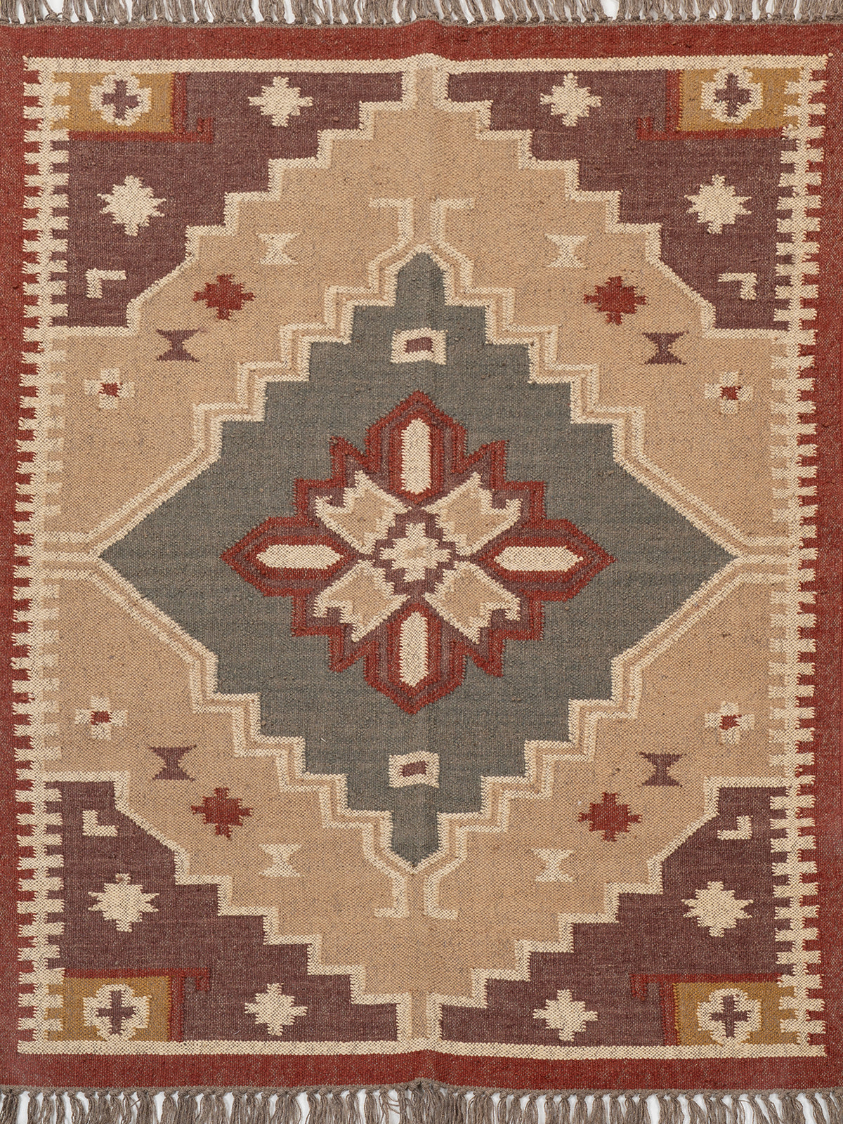 The Fortress Shield Kilim wool rug in red tones