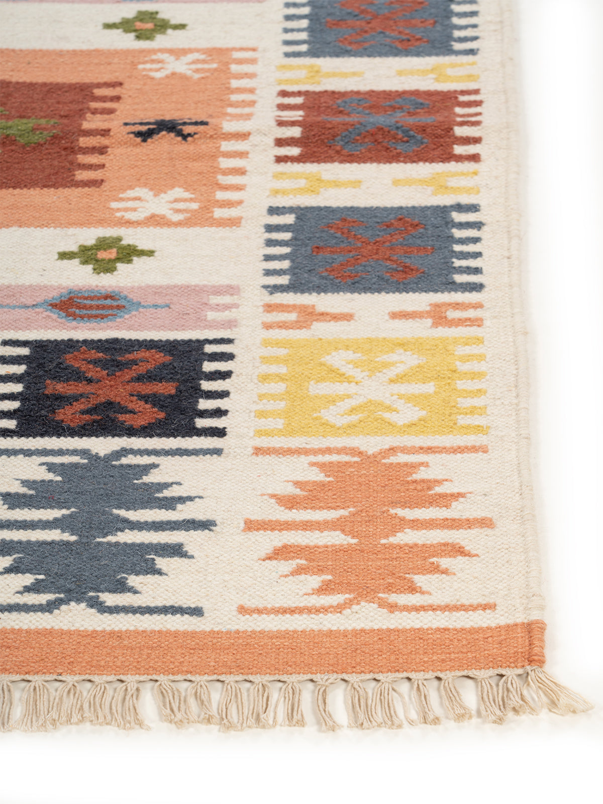 The Garden Tapestry Rug wool rug styled in a living room interior
