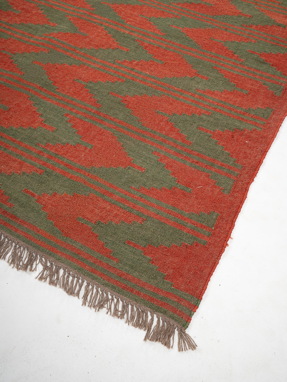 The Grove Wave Rug close-up showing the wool weave and geometric motif