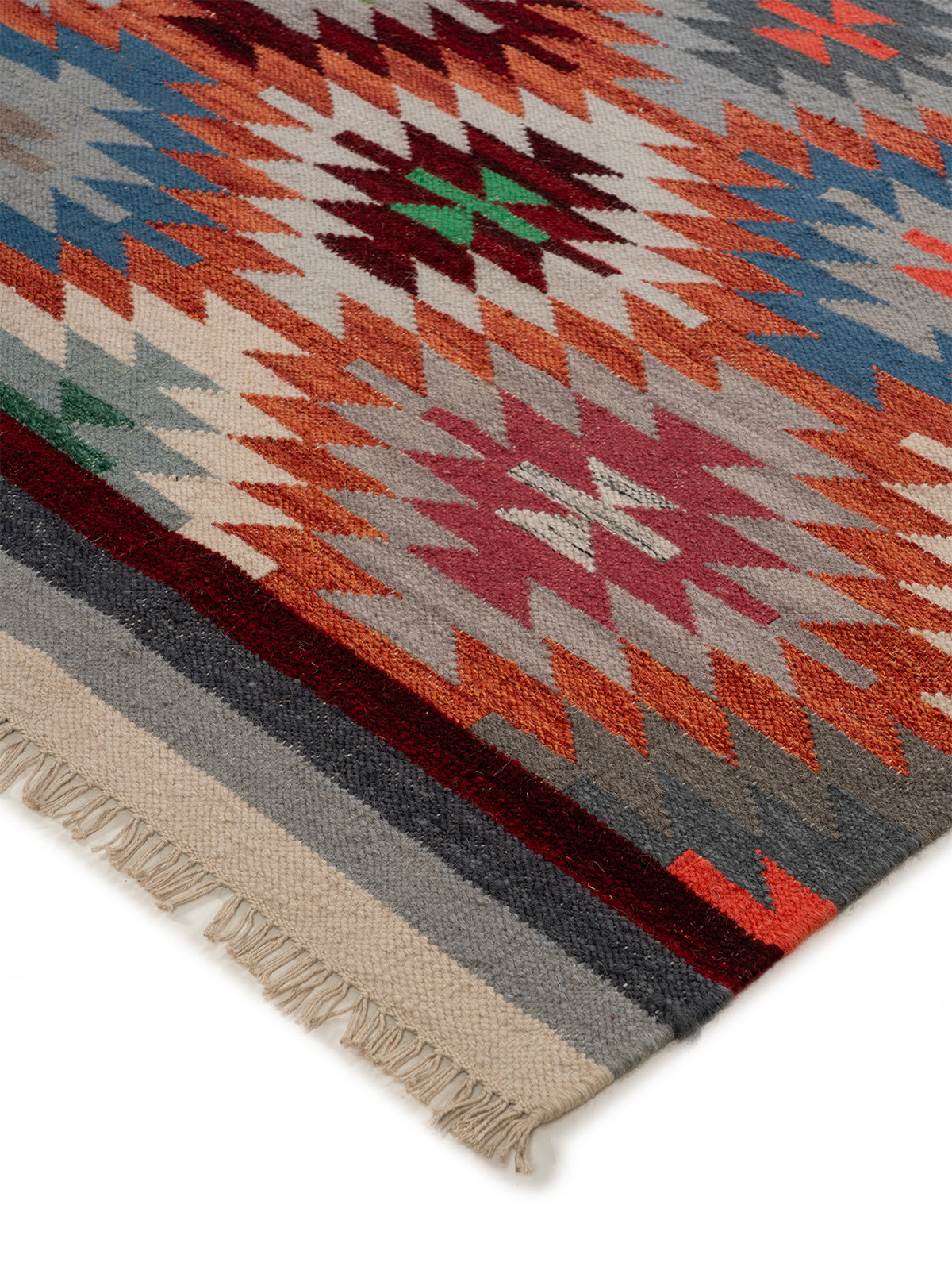 The Kaleidoscope Rug close-up showing the wool weave and geometric motif