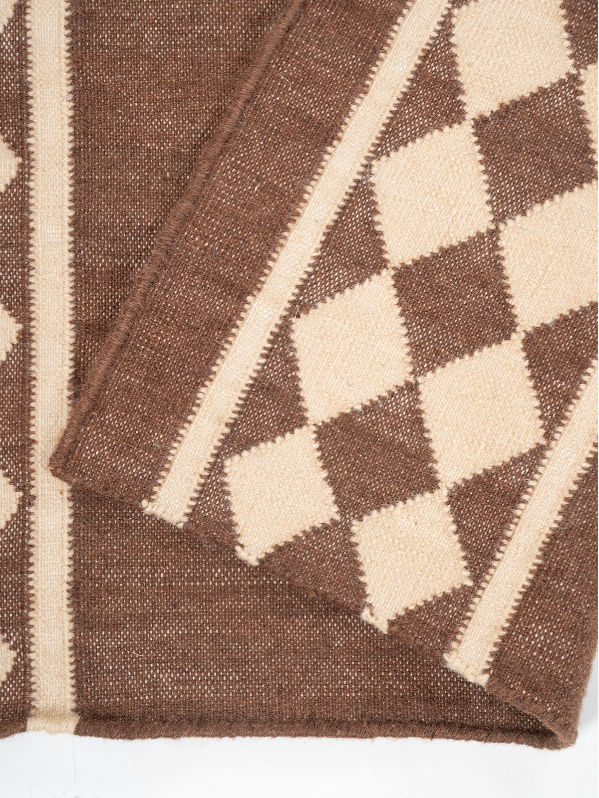 The Lattice Lane Runner detail showing edge binding and cotton finishing of the runner