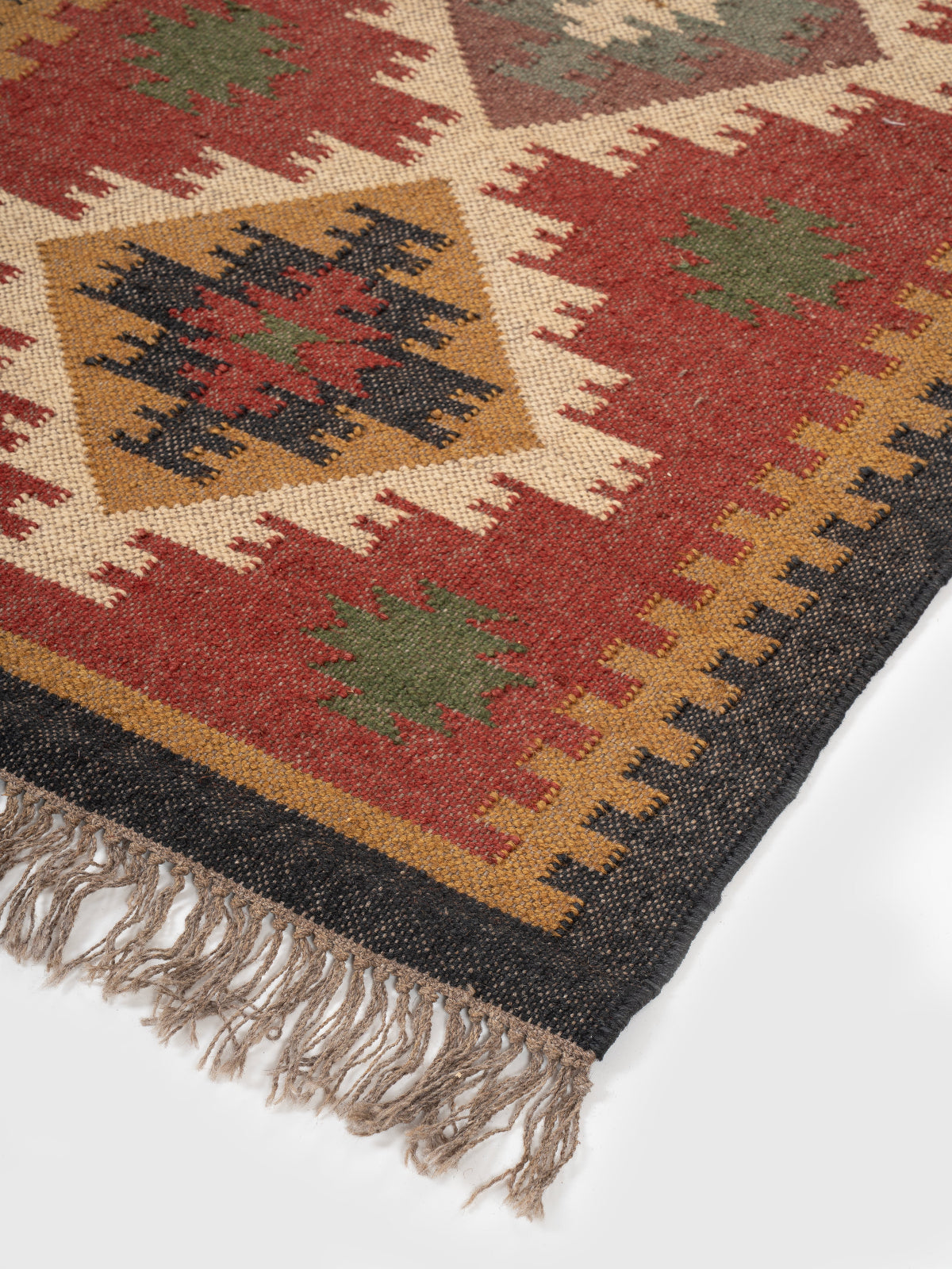 The Lunar Arrowhead close-up showing the wool weave and geometric motif
