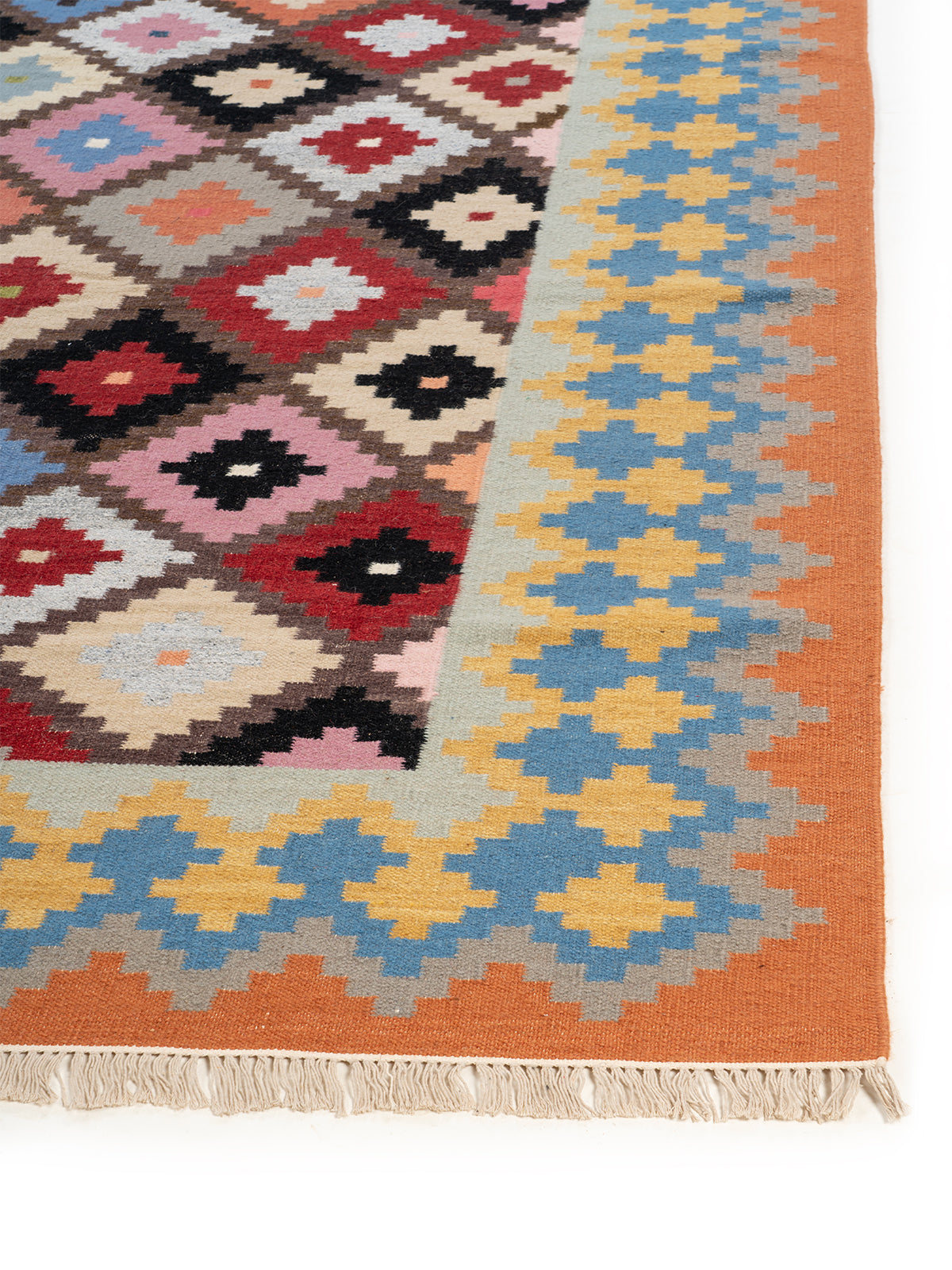The Moroccan Bazaar Rug wool rug styled in a living room interior