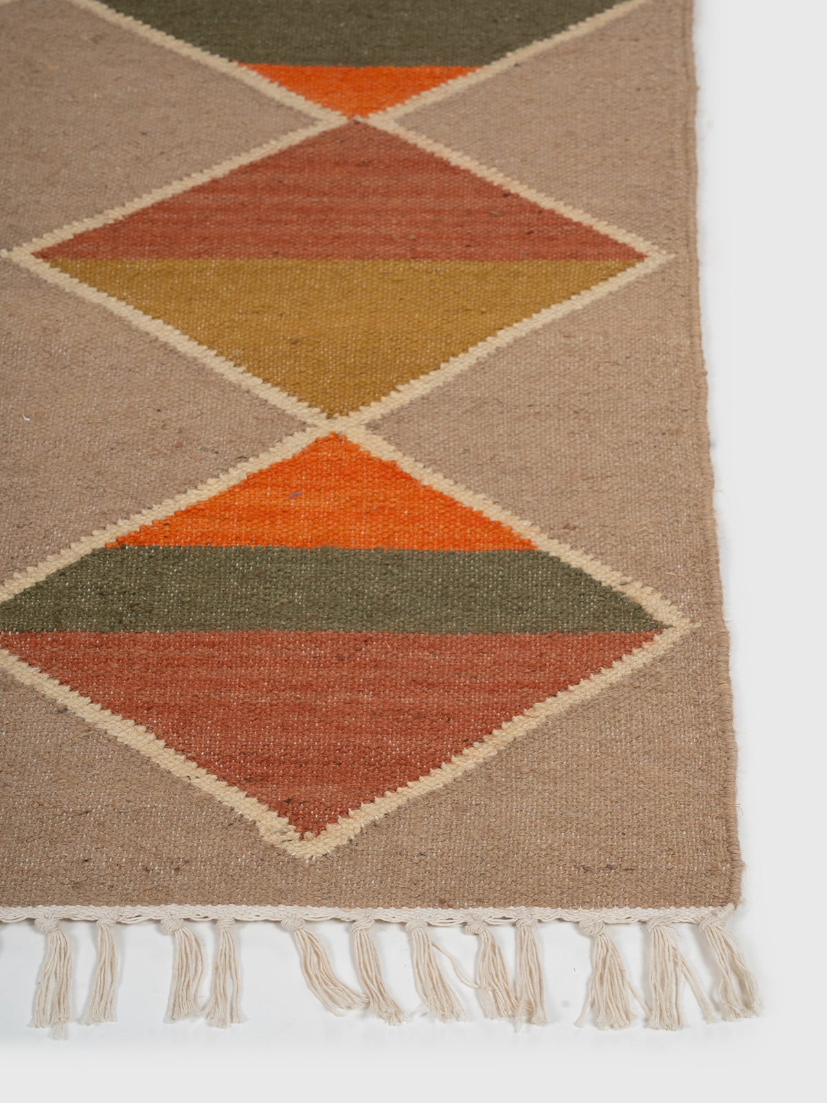 The Orchard Quilt Kilim wool rug styled in a living room interior