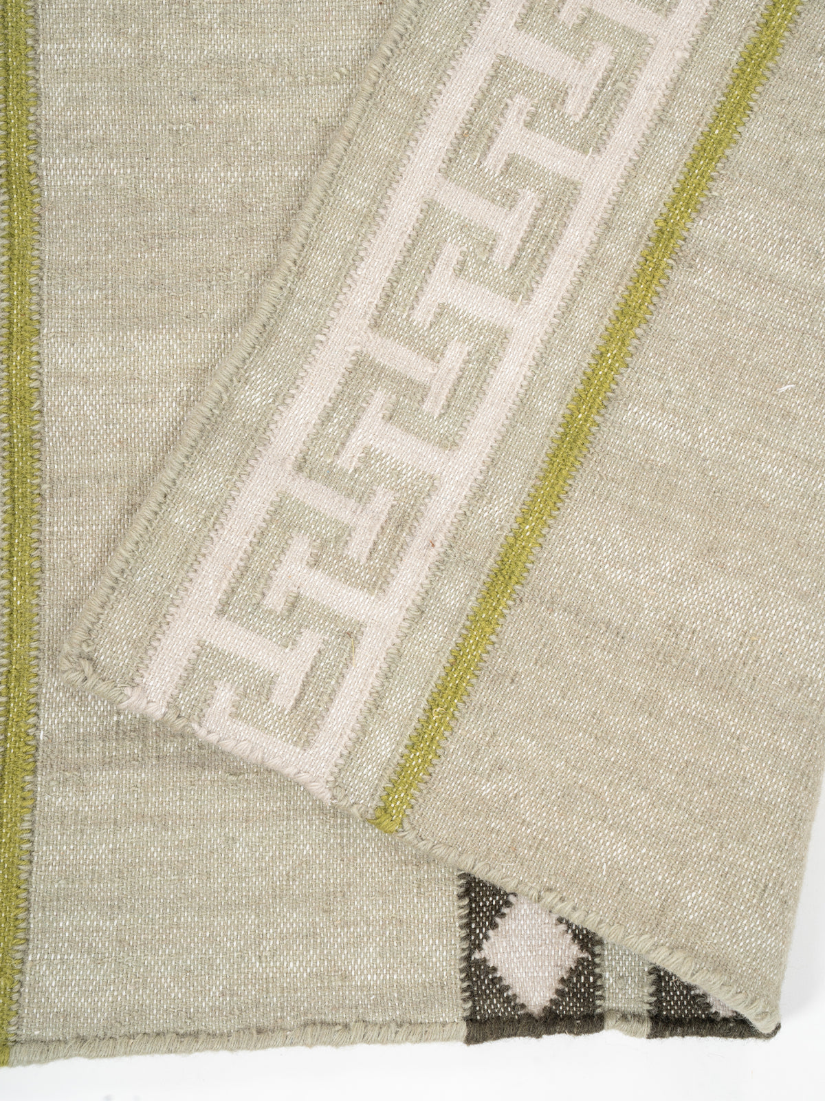 The Palace Key Runner-Green - cotton runner laid in a hallway view