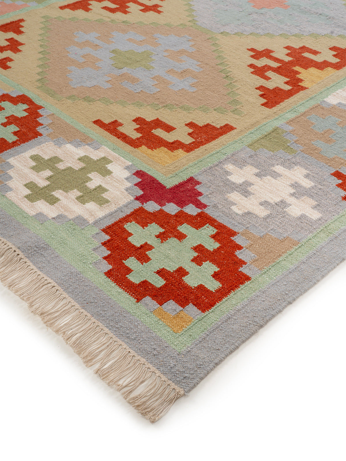 The Pastel Mosaic Rug close-up showing the wool weave and geometric motif