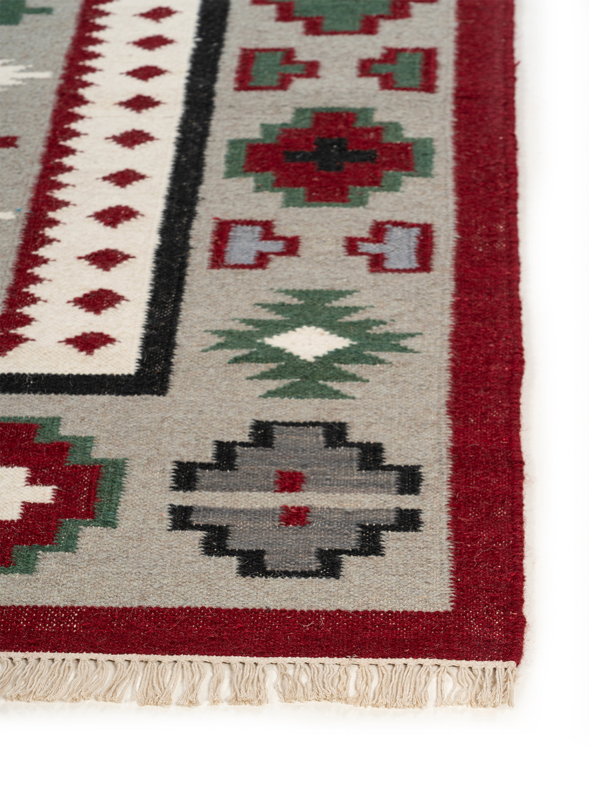 The Rustic Medallion Rug wool rug styled in a living room interior