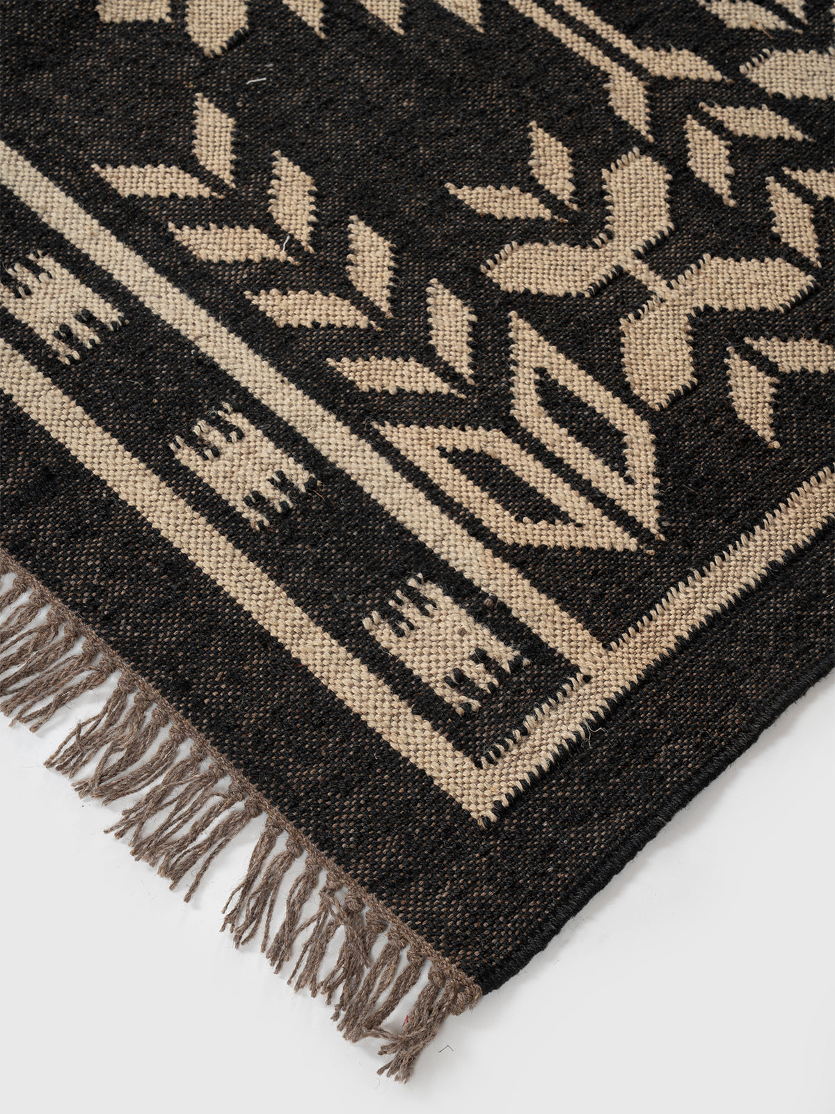 The Sky Strata Rug close-up showing the wool weave and striped pattern