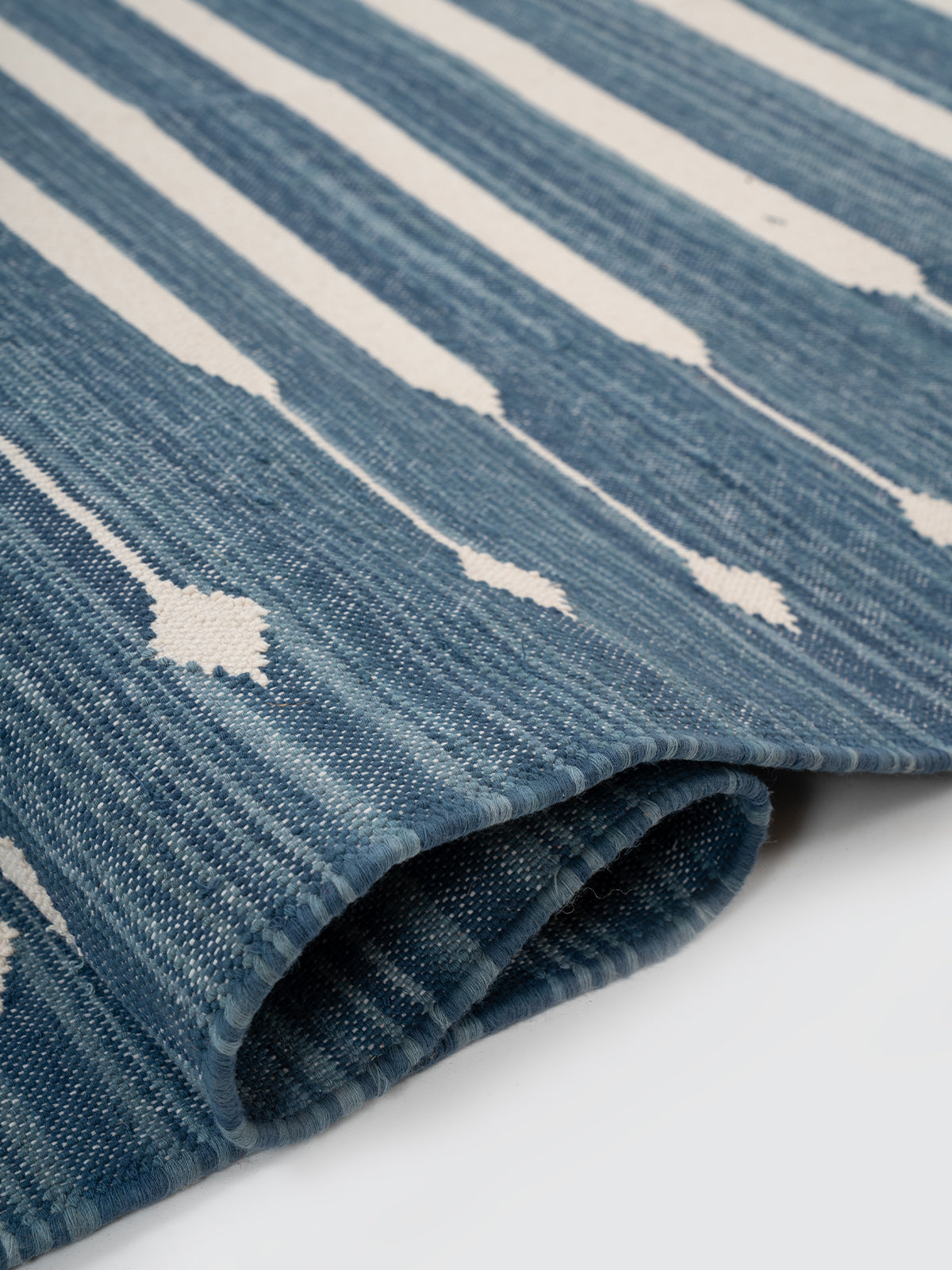 The Subtle Bloom Runner-Blue - cotton runner laid in a hallway view