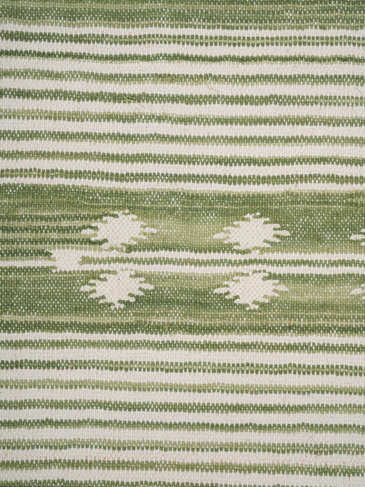 The Subtle Bloom Runner-Green - cotton runner laid in a hallway view