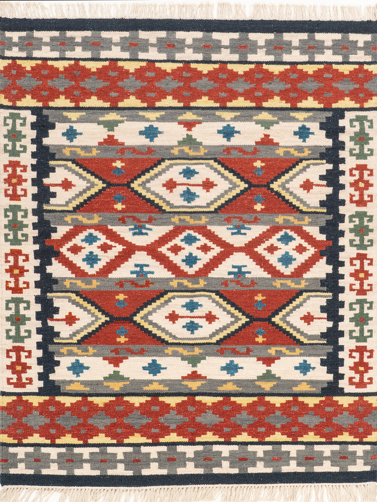 The Tribal Fortress Rug wool rug in red tones