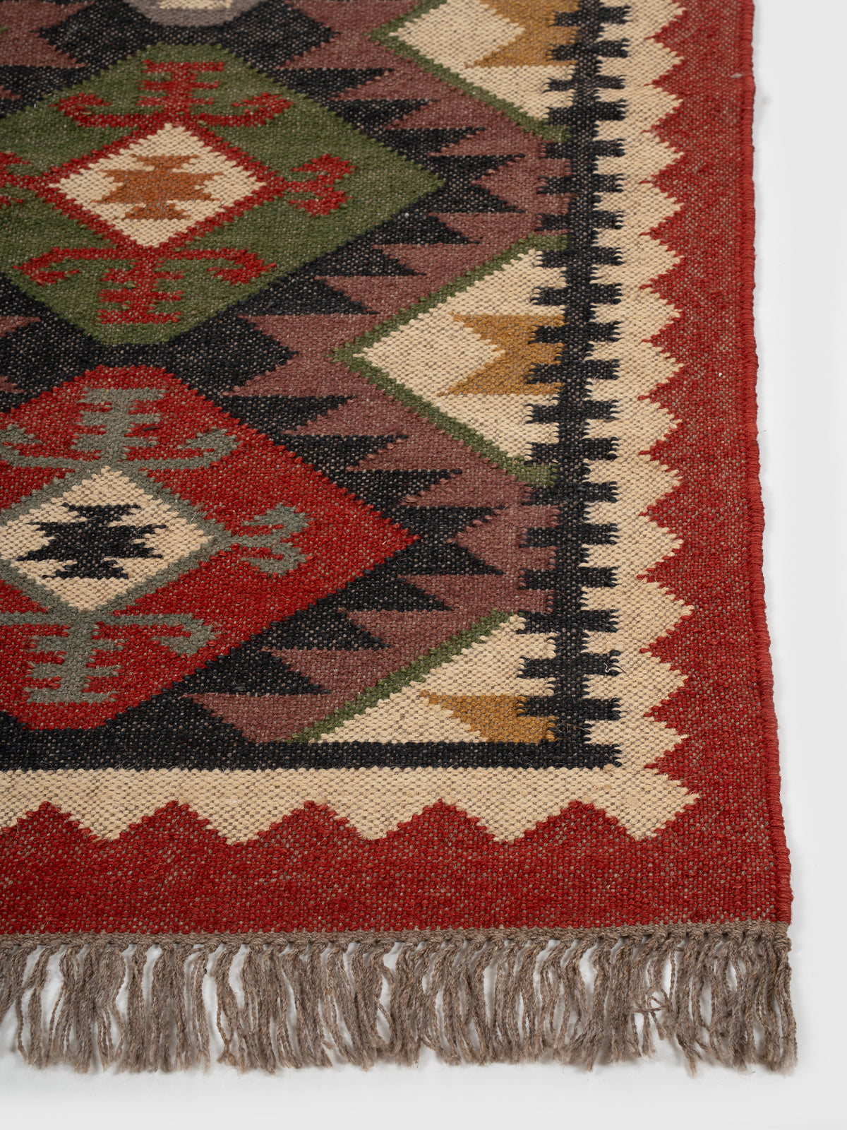 The Tribal Gem Runner wool stair runner styled on a staircase in a designed interior