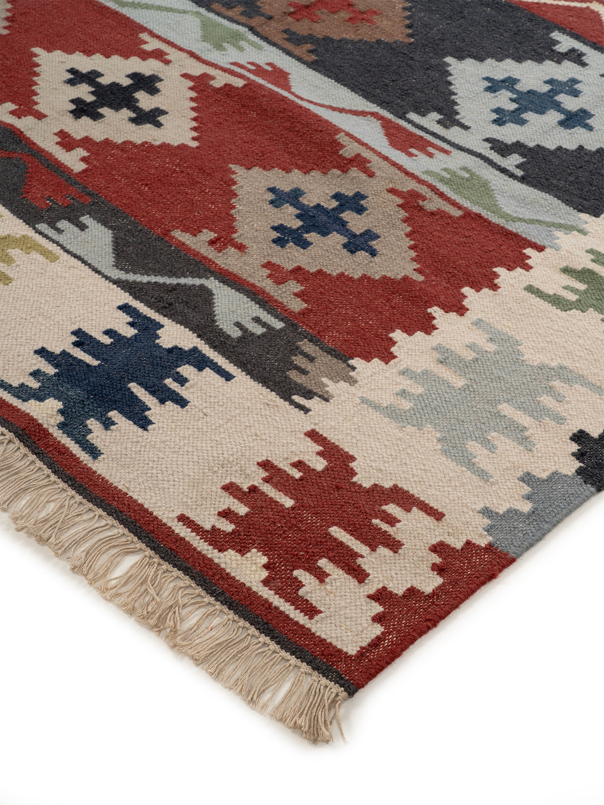 The Tribal Journey Rug close-up showing the wool weave and traditional motif