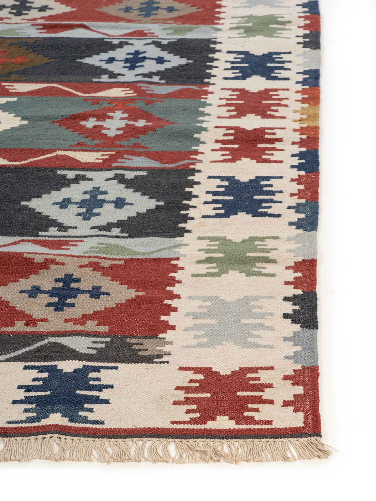 The Tribal Journey Rug wool rug styled in a living room interior