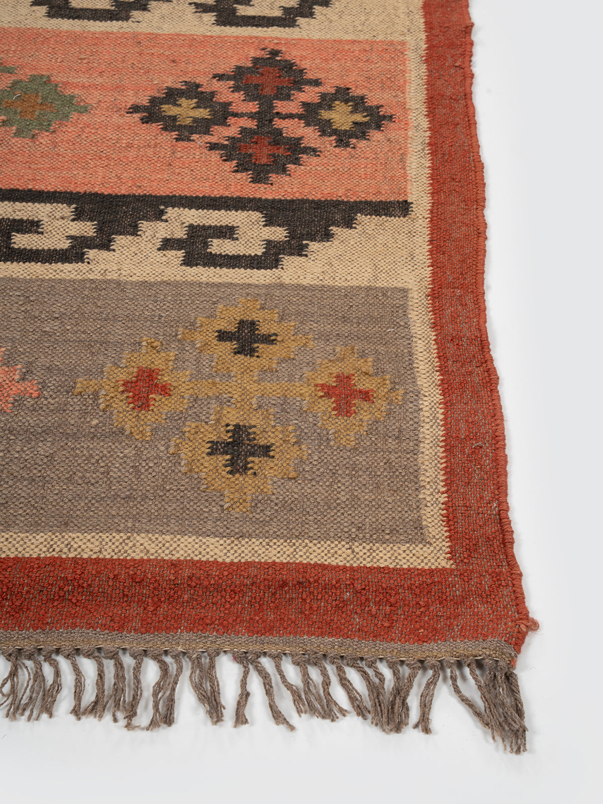 The Tribal Segment Runner wool stair runner styled on a staircase in a designed interior