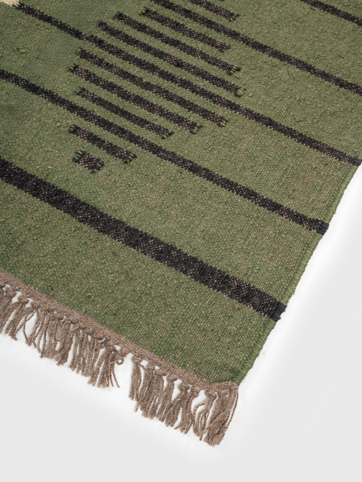 The Verdant Stripe Kilim close-up showing the wool weave and striped pattern