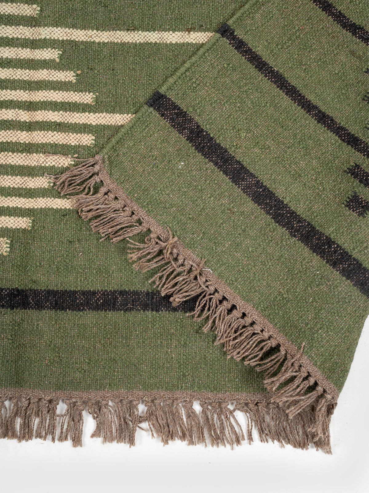 The Verdant Stripe Kilim detail of the striped wool surface and edge finishing