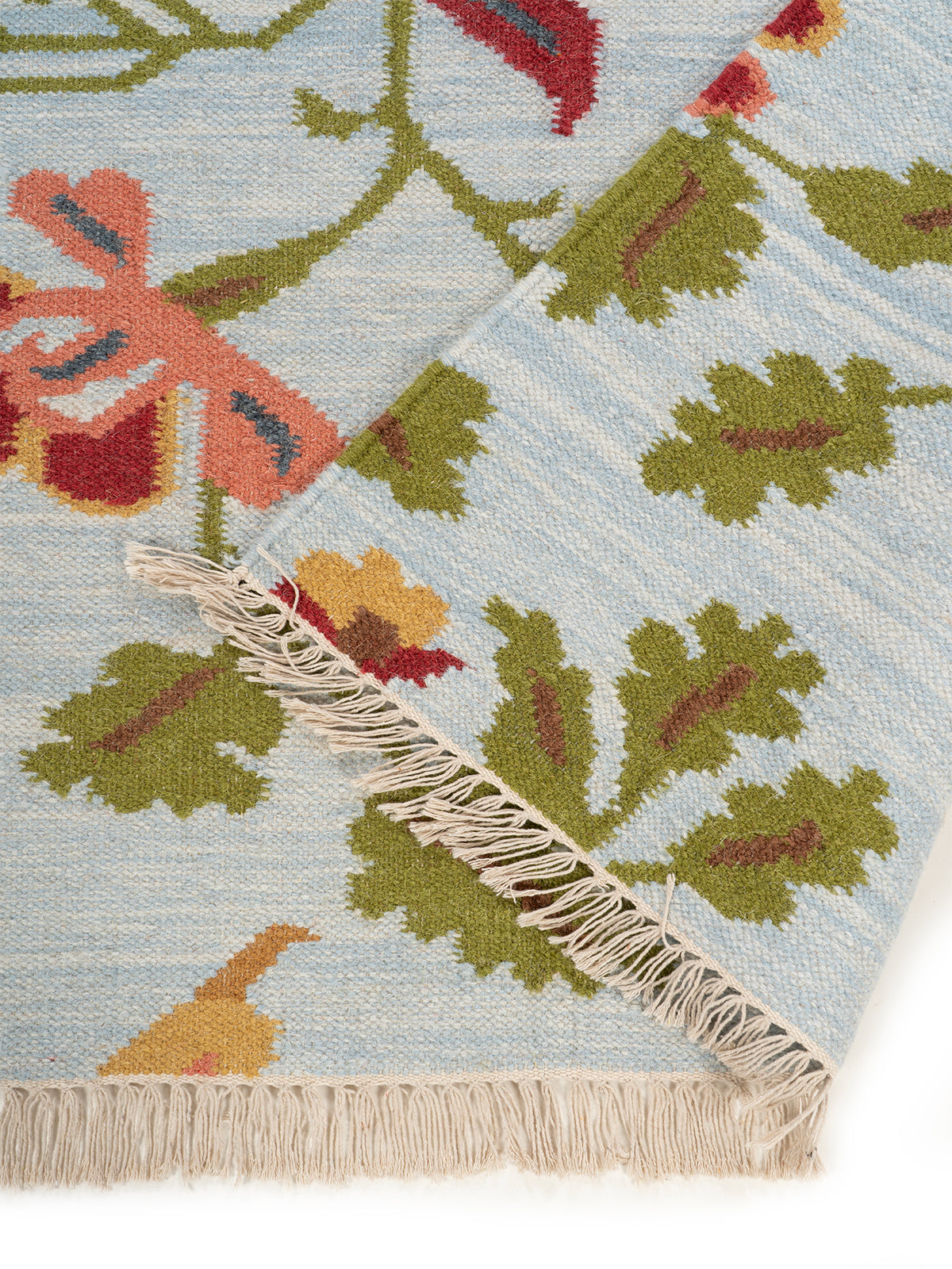 The Wildflower Bloom Rug detail of the floral motif in wool cut pile