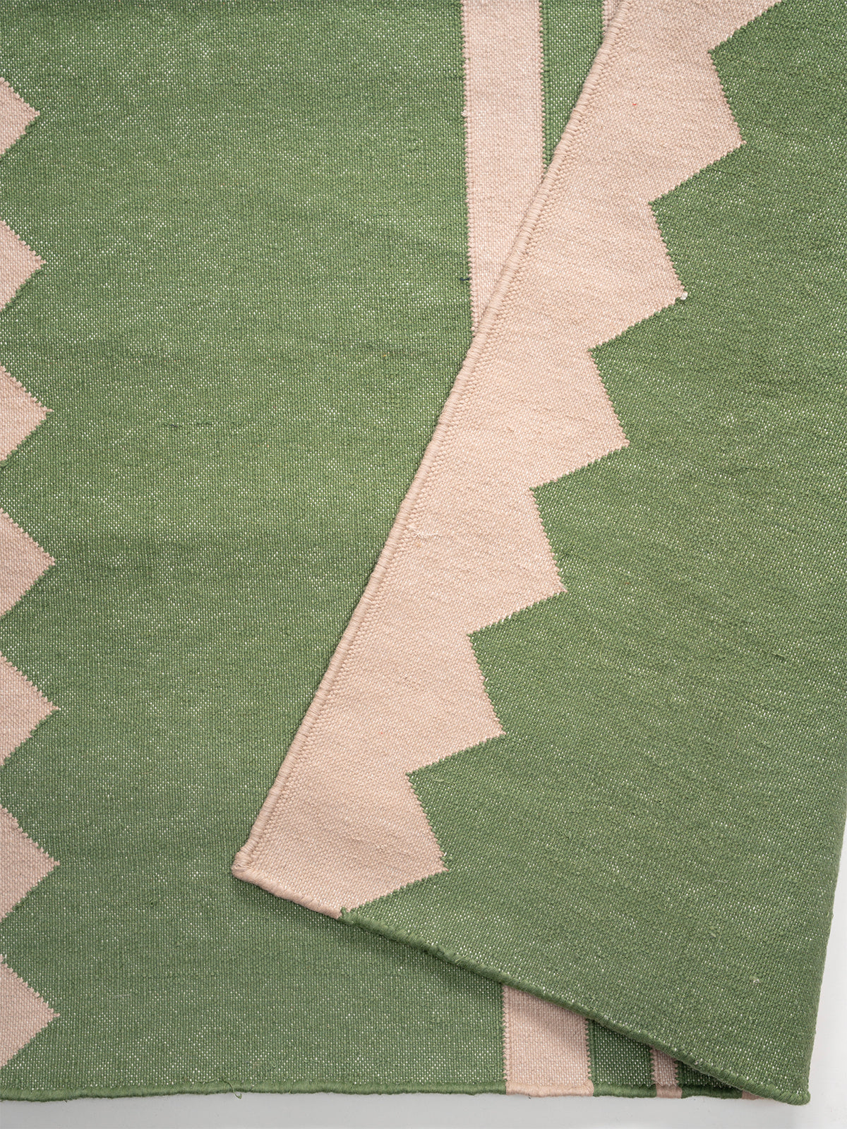 The Zigzag Trail Runner- Basil detail showing edge binding and cotton finishing of the runner