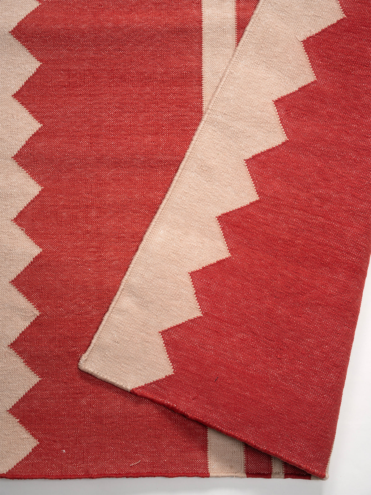 The Zigzag Trail Runner- Cherry - cotton runner laid in a hallway view
