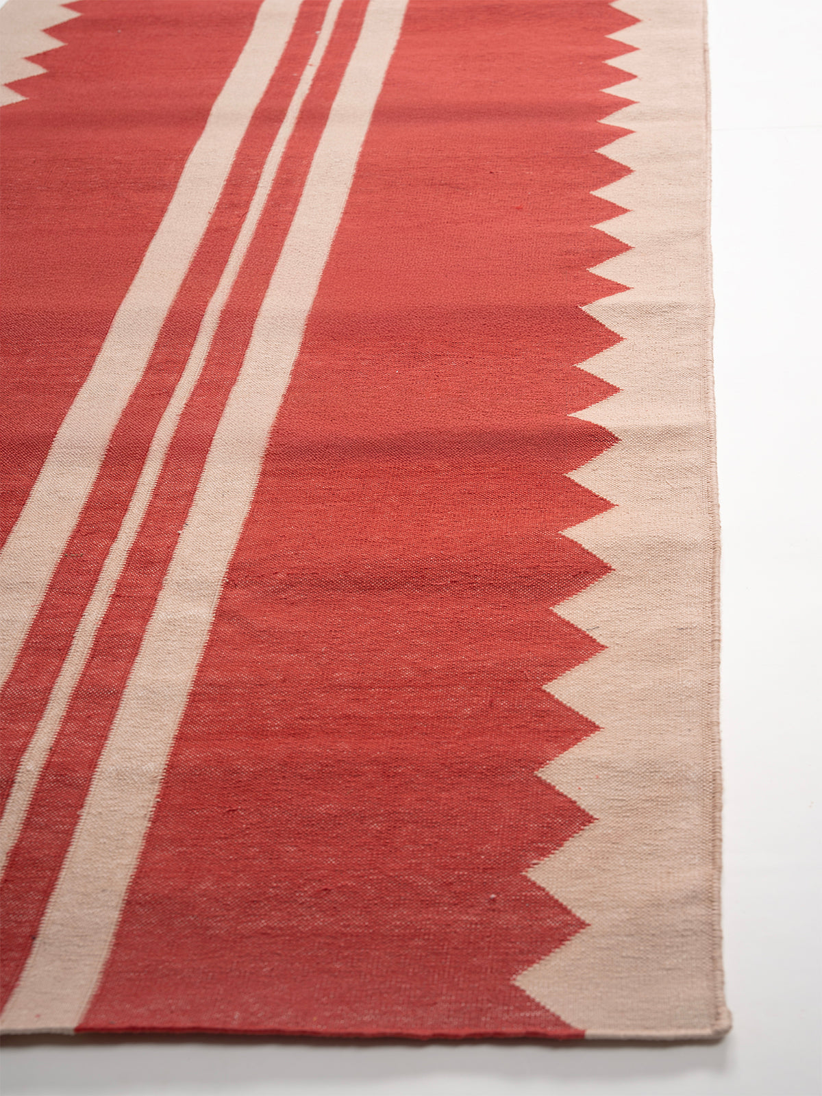 The Zigzag Trail Runner- Cherry - cotton runner laid in a hallway view