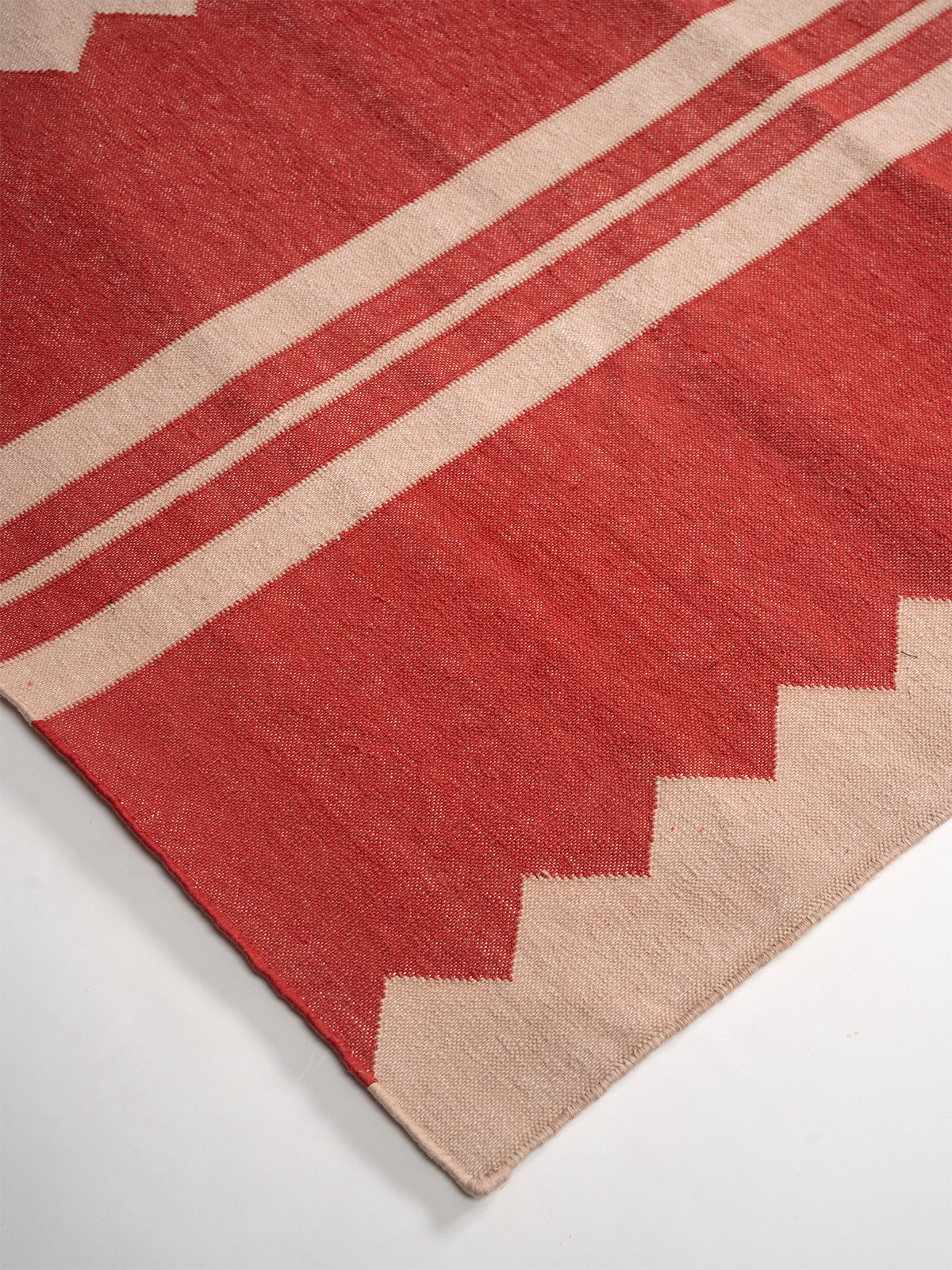 The Zigzag Trail Runner- Cherry close-up showing the cotton weave and geometric surface