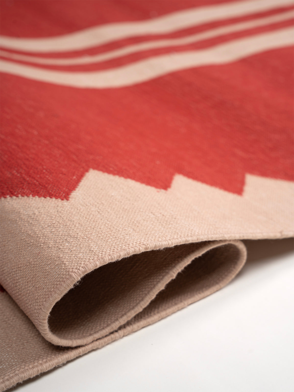 The Zigzag Trail Runner- Cherry detail showing edge binding and cotton finishing of the runner