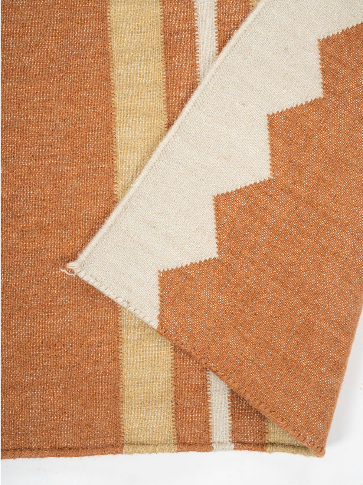 The Zigzag Trail Runner-Rust detail showing edge binding and cotton finishing of the runner
