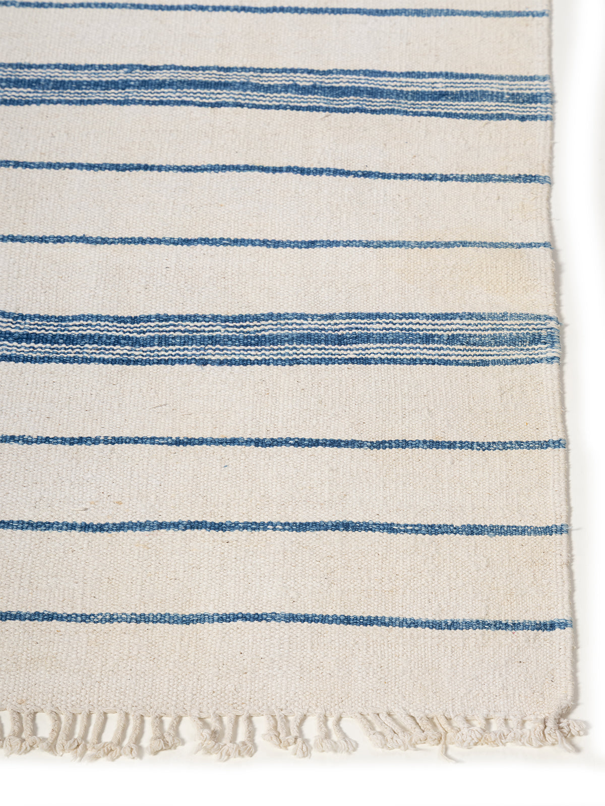 Tidal Flow Rug cotton rug styled in a living room interior