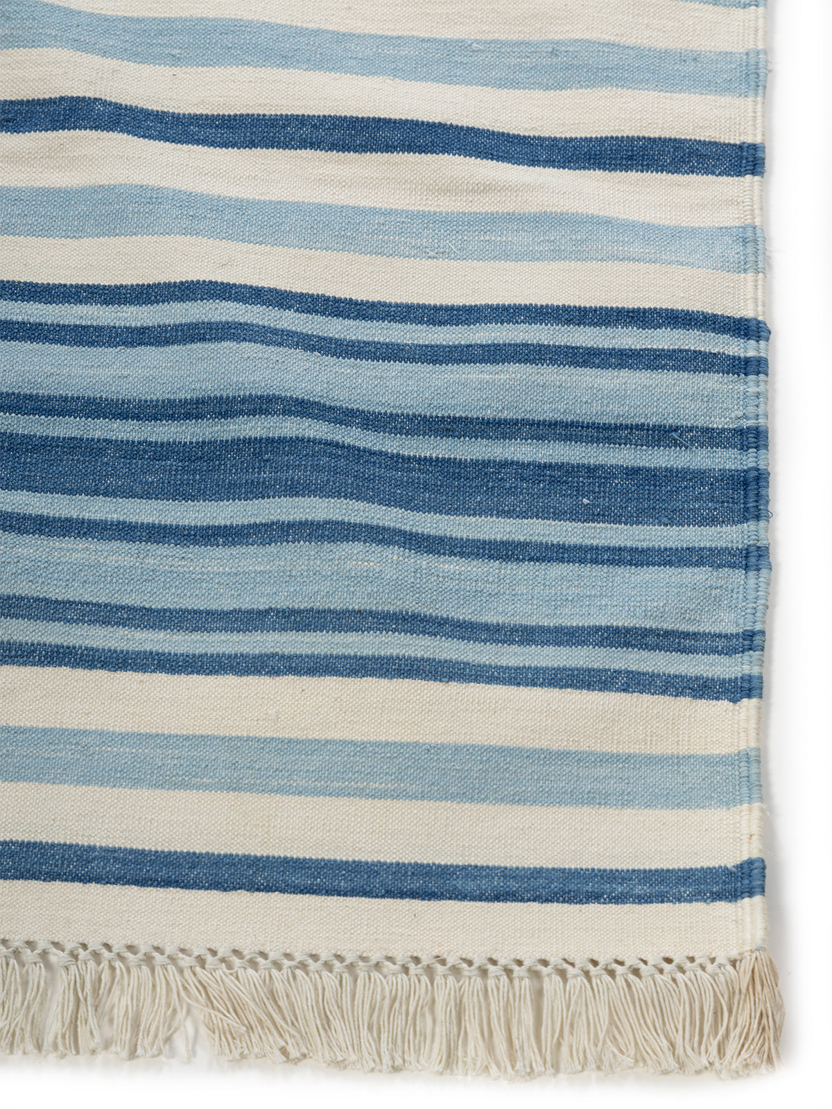 Tidal Flow cotton rug styled in a living room interior