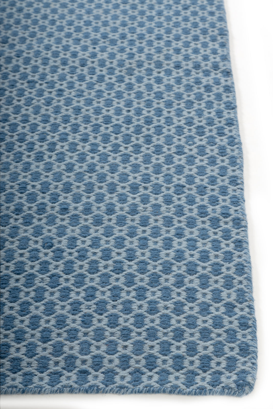 Tideway Loom Rug wool rug styled in a living room interior