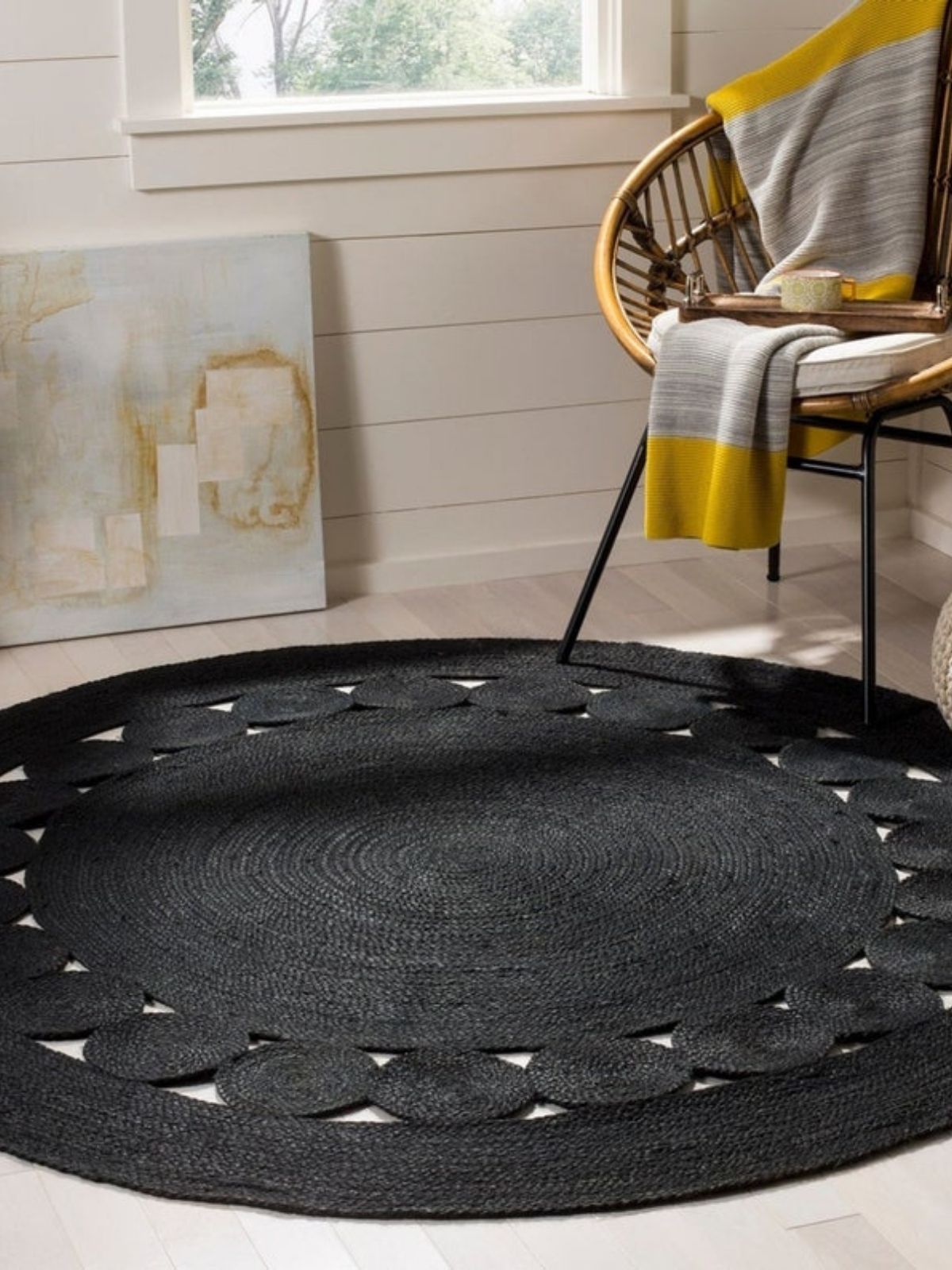 Tunis round jute rug-Black jute rug styled in a living room interior