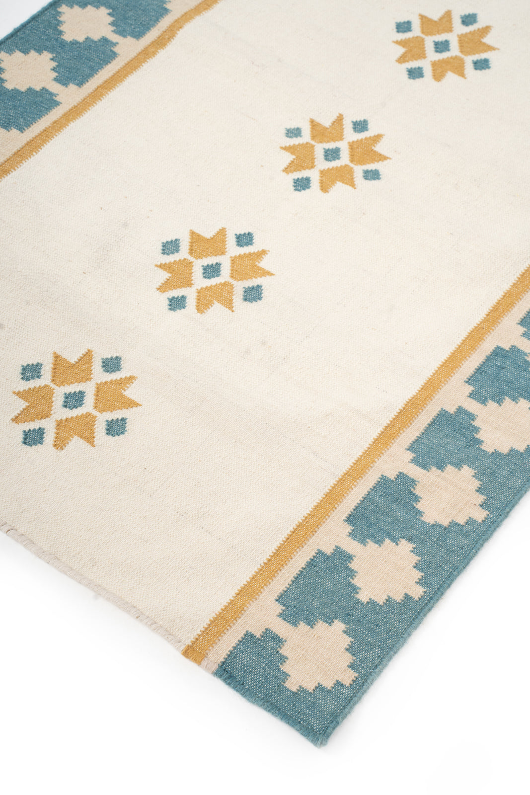 Turquoise Crossroads close-up showing the wool weave and geometric motif