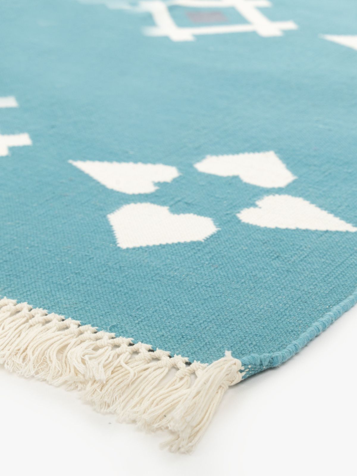 Turquoise Flatweave rug close-up showing the cotton weave and surface texture