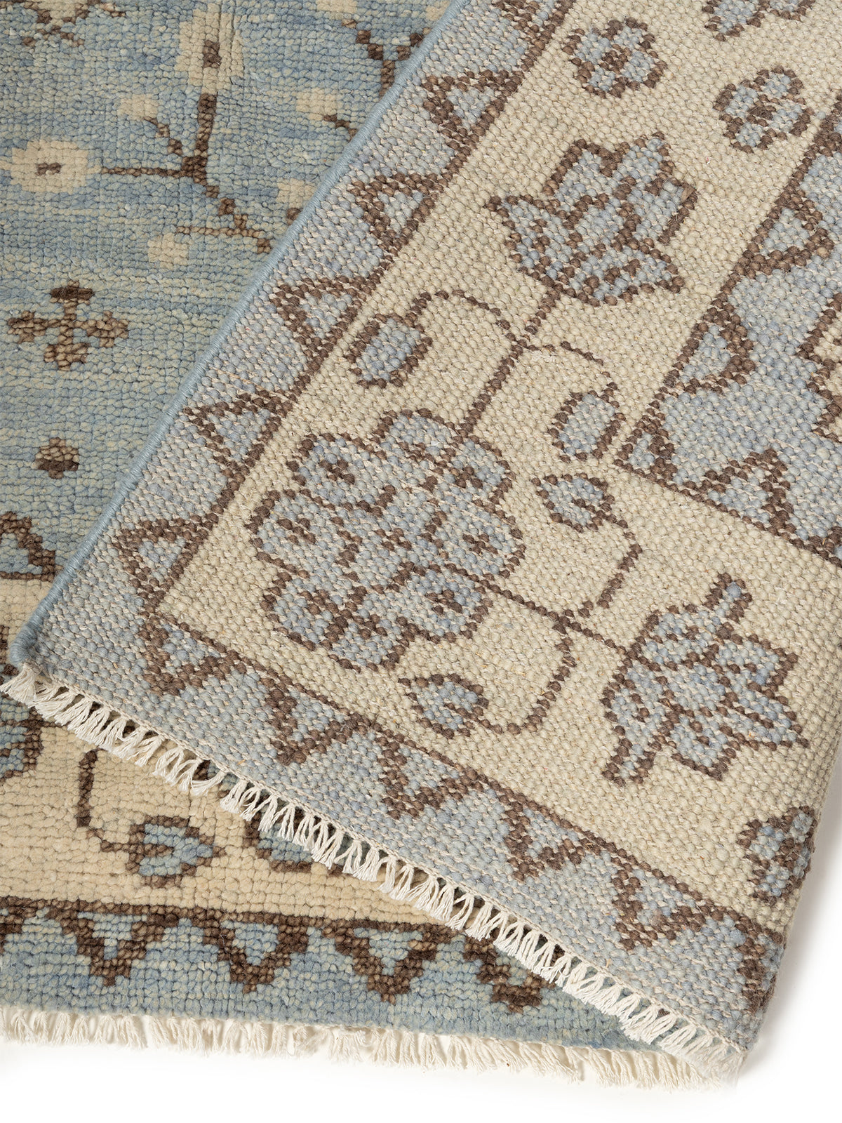 Twilight Bloom Oushak Rug detail of the floral motif in wool cut pile