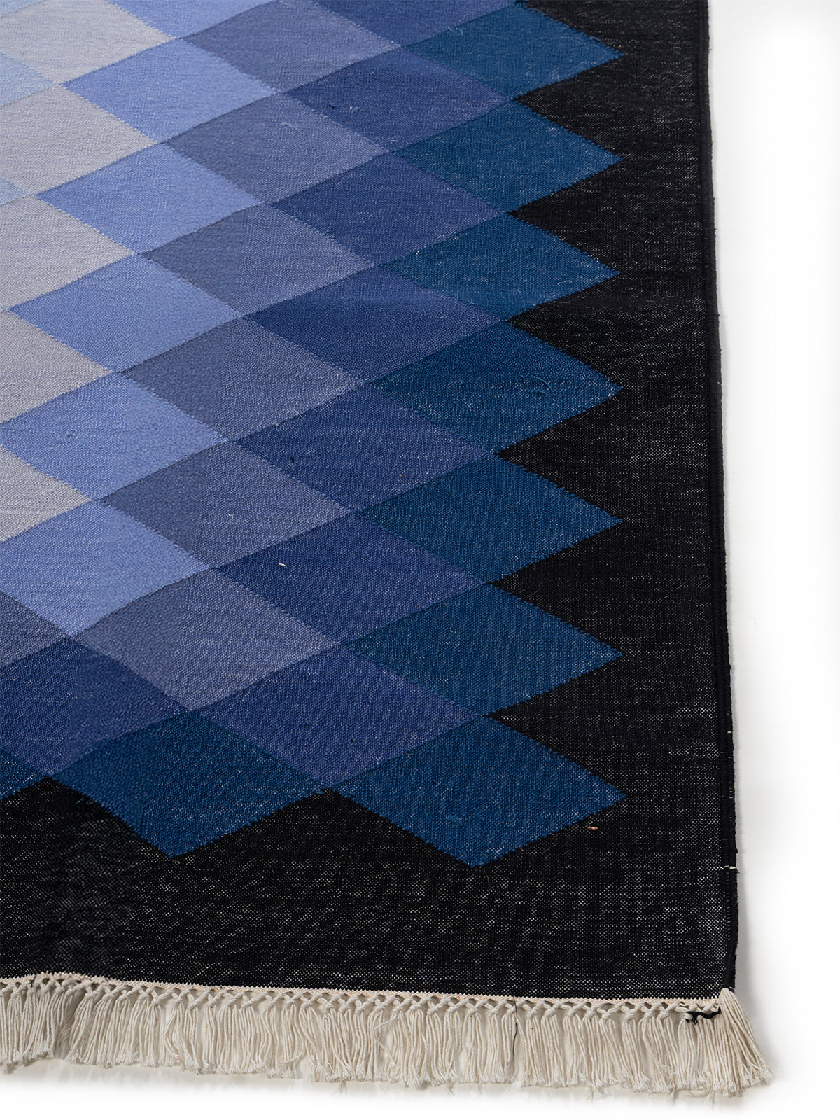 Twilight Cascade Rug cotton rug styled in a living room interior