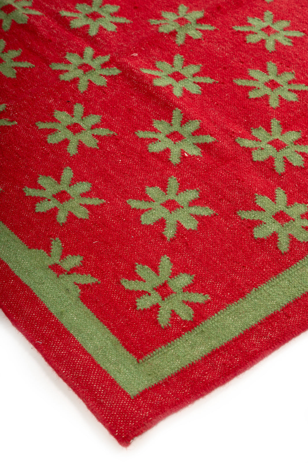 Verdant Bloom Wool Dhurrie close-up showing the wool pile and floral motif