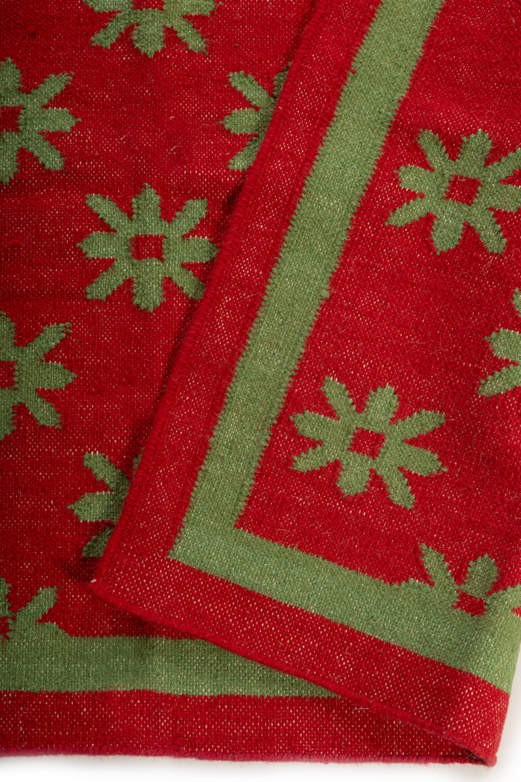 Verdant Bloom Wool Dhurrie detail of the floral motif in wool cut pile